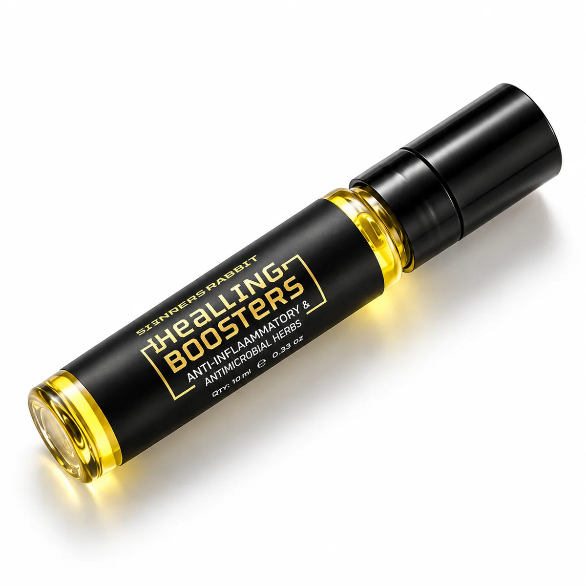 A black cylindrical roller bottle with a black cap, containing a golden-yellow liquid, labeled 'Healing Boosters' by Sinners Rabbit. The bottle is positioned diagonally on a clean white background with a soft shadow.